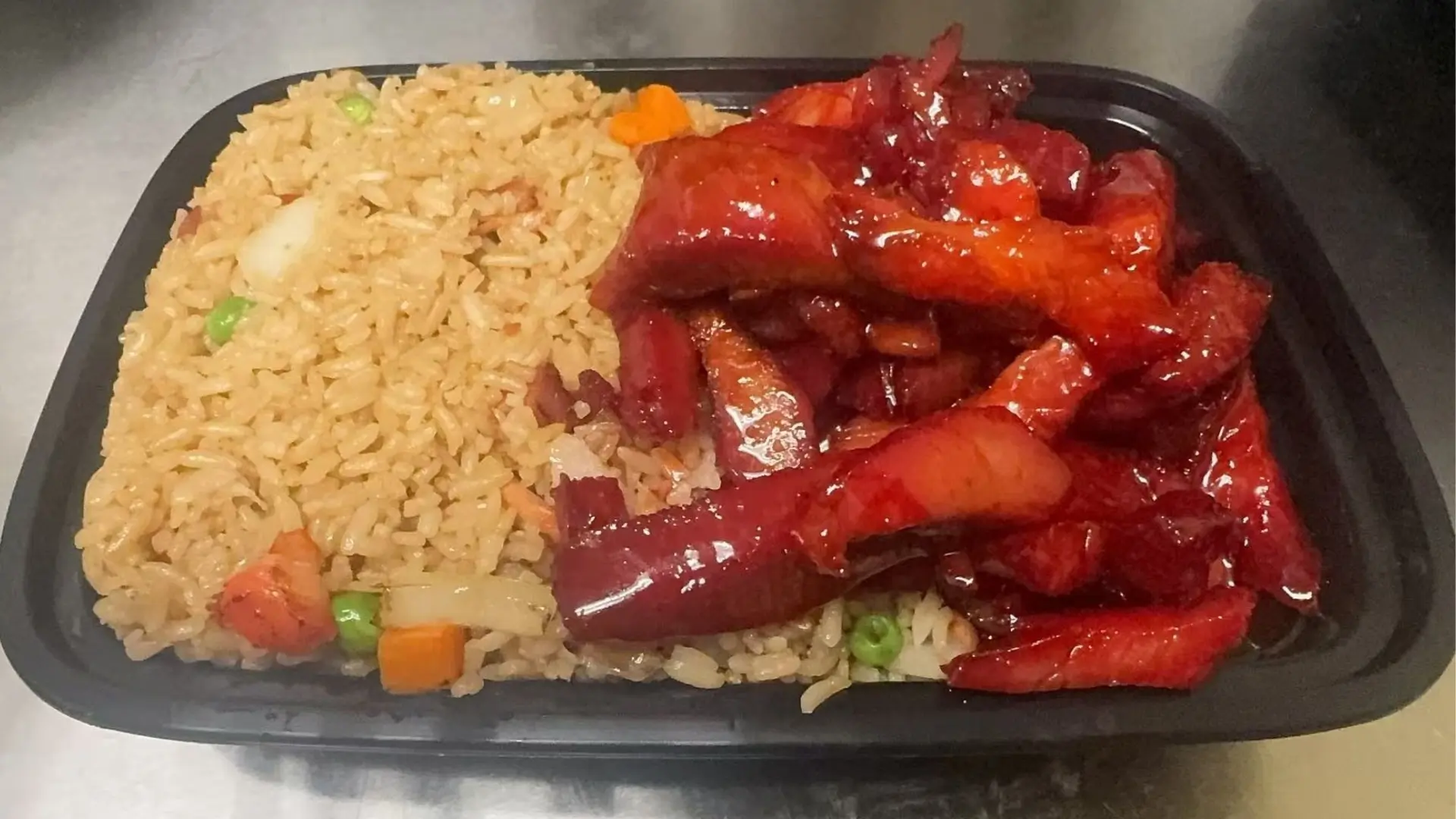 BBQ pork served with fried rice, a Chinese Restaurant in Rochester.